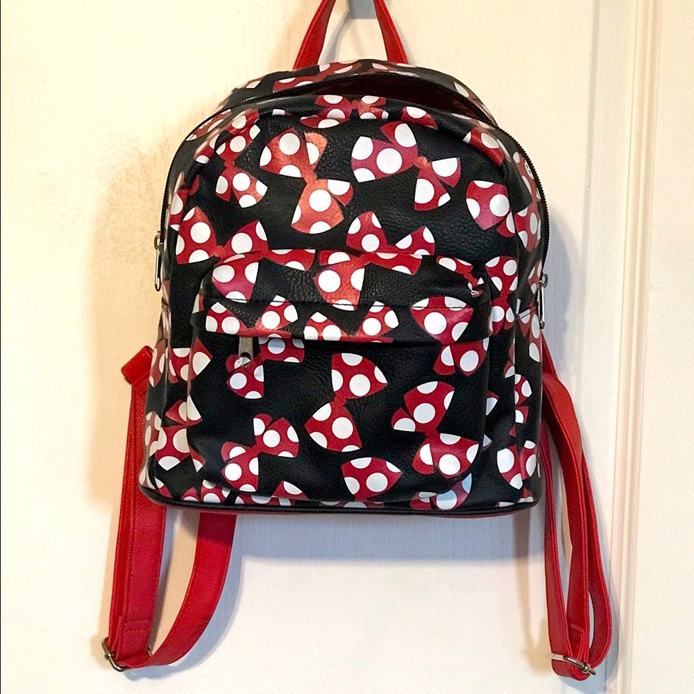 A beautiful Mini Disney Backpack with one packet outside.
